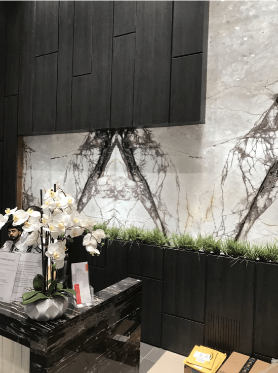 Book-matched Calacatta marble shower wall